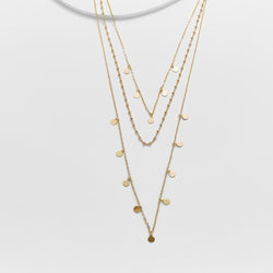 Triple strand necklace with medallion charms